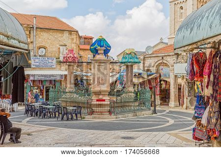 JERUSALEM, ISRAEL - MAY 23, 2016: Early afternoon by the Muristan fountain at center of market area in Old City.