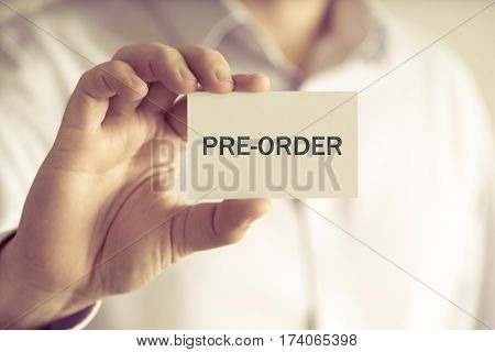 Businessman Holding Pre-order Message Card