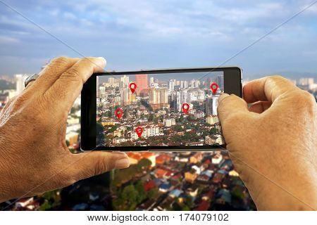 Hand holding smart phone seaching for location