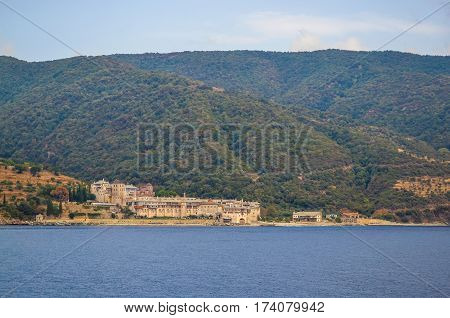 Orthodox Greek monastery on Mount Athos. View from sea. Xenophon.