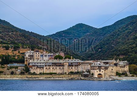 Orthodox Greek monastery on Mount Athos. View from sea. Xenophon.