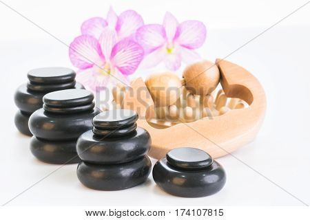 Spa therapy with hot stones, massage roller and cellulite massager