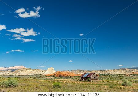 An abandoned log cabin sits neglected in Kodachrome Basin Utah.