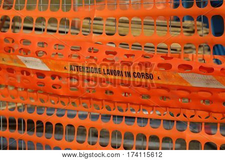 Plastic Orange Safety Net To Delimit The Area Of A Road Construc