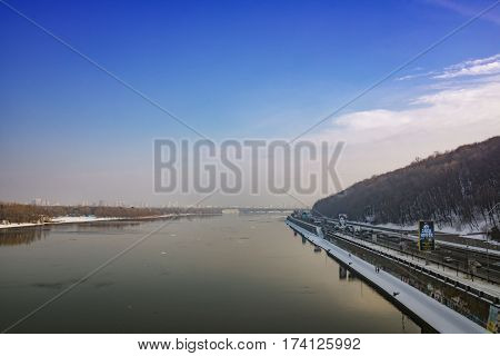 Kiev, Ukraine - February 18, 2017: Top view of the Dnieper park and havana bridge a winter day