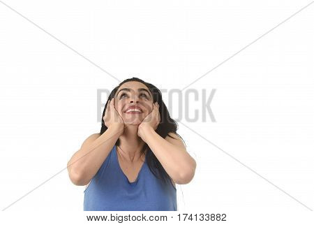 head and shoulders portrait of young beautiful hispanic woman looking up to blank copy space surprised in shock and disbelief isolated on white background in surprise face expression