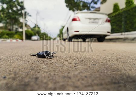 abstract car key fall on the cement ground - can use to display or montage on product