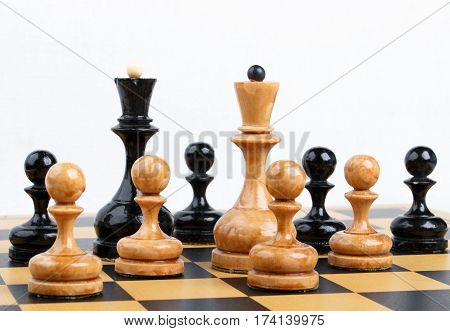 The chess pieces placed on the chessboard. White background