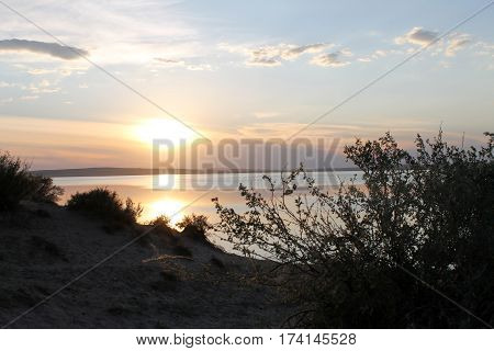 the setting sun reflected in the pond, lake, water, transparent