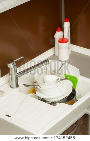 close up hands of Woman Washing Dishes in the kitchen