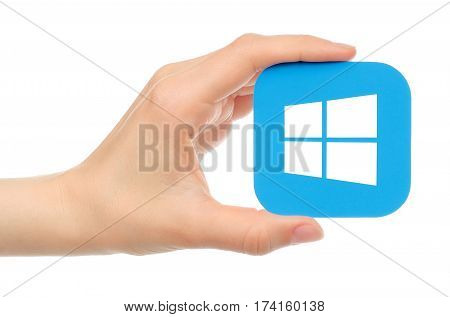 Kiev Ukraine - May 17 2016: Hand holds Microsoft Windows icon printed on paper