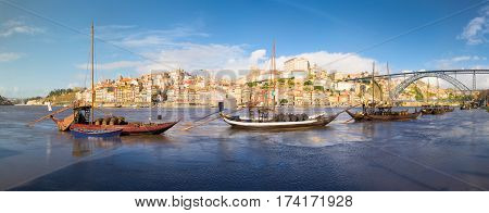 Porto old town cityscape on the Douro River with traditional Rabelo boats. Portugal