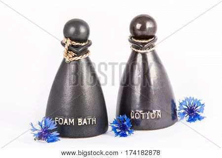 Foam bath and lotion in the special jars with cornflowers