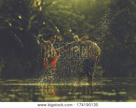 Thai boxing at the river in Thailand.