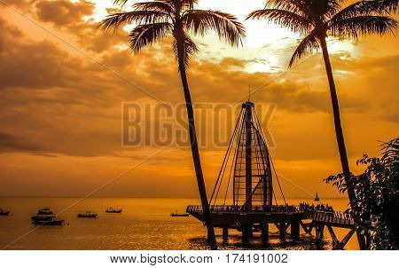 Los Muertos Pier during stunning Puerto Vallarta sunset.