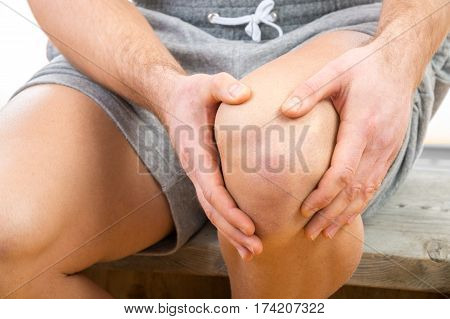 Man With Knee Pain Over White Background