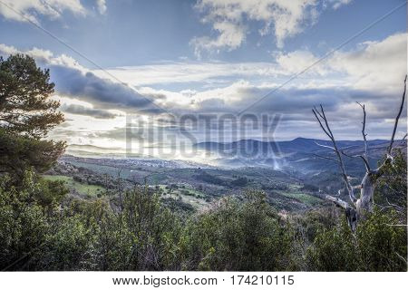 Overview of the Guadalupe town during a foggy sunrise Caceres Spain