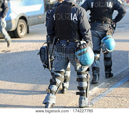 Italian Police In Riot Gear With Flak Jackets And Protective Hel