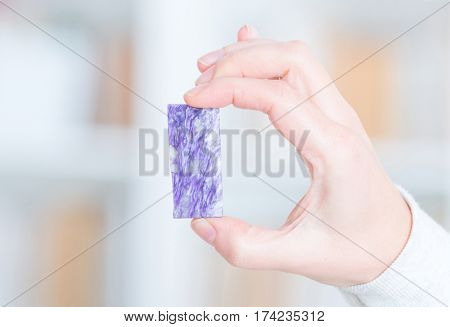Charoite rare preciouse gemstone in hand
