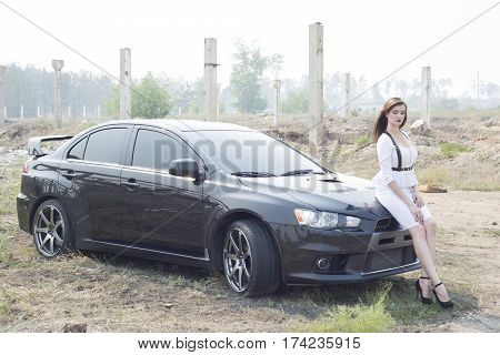 Beautiful Girl Detective Near The Sports Car.