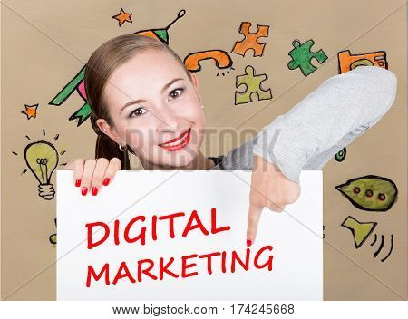 Young woman holding whiteboard with writing word: digital marketing. Technology, internet, business and marketing
