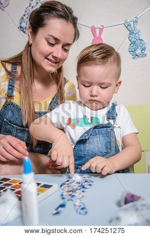 mother with kid paint and drawing have time togather