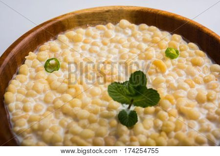 Dahi Bundi or Boondi Raita, favourite indian started or side dish made using Rajasthani snack food made from sweetened, fried chickpea flour, called Boondi with sweet and salty curd or buttermilk
