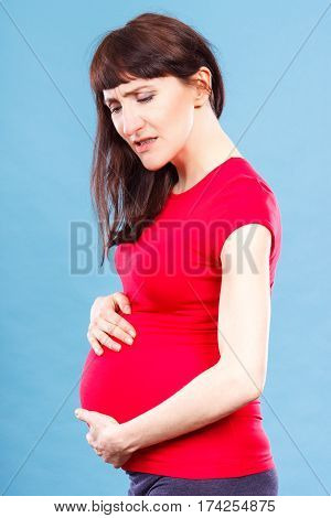 Sad Pregnant Woman With Stomach Pain Touching Her Belly, Aches In Pregnancy And Risk Of Miscarriage