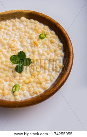 Dahi Bundi or Boondi Raita, favourite indian started or side dish made using Rajasthani snack food made from sweetened, fried chickpea flour, called Boondi with sweet and salty curd or buttermilk