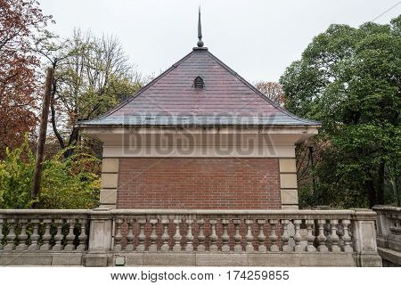 Madrid Spain - November 20 2016: Pavillion in Retiro Park a cloudy day. The Buen Retiro Park is a large and popular park at the edge of the city centre