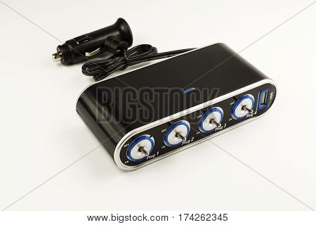 Four ports 12v car lighter on the light background