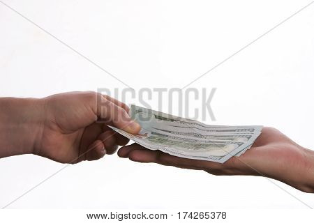 Close-up Of Person Hand Giving US dollar banknote money. Сoncept of salary.