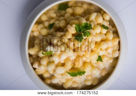 Dahi Bundi or Boondi Raita, favourite indian started or side dish made using Rajasthani snack food made from sweetened, fried chickpea flour, called Boondi with sweet and salty curd or buttermilk