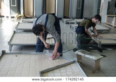 Workers Assemble Shower Cabins Ship