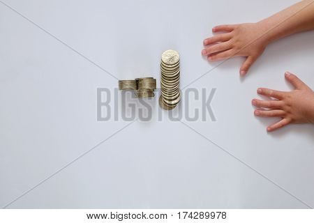 Child's hand holding Banknotes Isolated on white background.