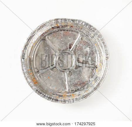 Used round tin foil cake pan on white background