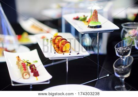 Molecular Modern Cuisine. Various Fancy Dishes On White Plates In A Restaurant.