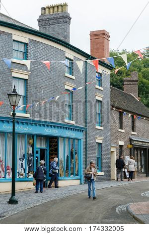 IRONBRIDGE UK - CIRCA 2013: Traditional victorian shops along an old street in Blists Hill Museum Ironbridge Shropshire UK