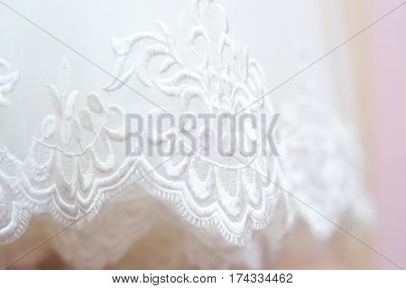 Beautiful white background of the wedding dresses with embroidery and ornaments