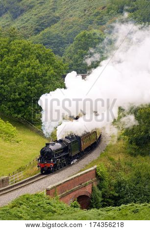 Steam Railway Engine in full steam running as The Yorkshire Coast Express