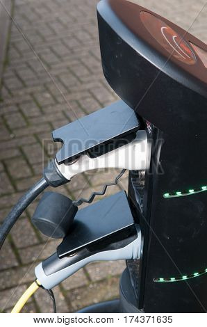 electric car charging to refuel at the charge station