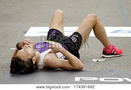 BARCELONA, SPAIN - FEB, 12: Unknown runner in the goal after finish his Barcelona Half Marathon in Barcelona on February 12, 2017 in Barcelona Spain