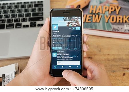 CHIANG MAI THAILAND - JAN 16 2017: A man holds Apple iPhone with social networking service Twitter on the screen. iPhone 6S was created and developed by the Apple inc.