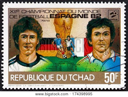 CHAD - CIRCA 1982: a stamp printed in Chad shows Pierre Littbarski and Platini soccer players circa 1982