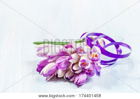 Bouquet of crocuses on a wooden table