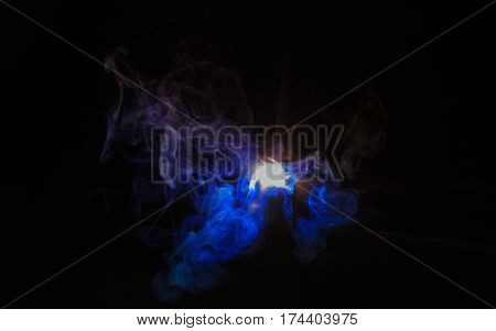 Metal Welding with sparks, Shielded metal arc welding (SMAW) process.