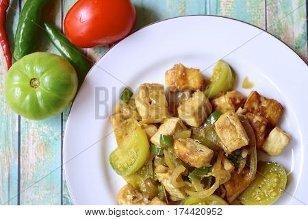 Stir fried tofu with green tomato and chili or Oseng Tahu, Indonesian food