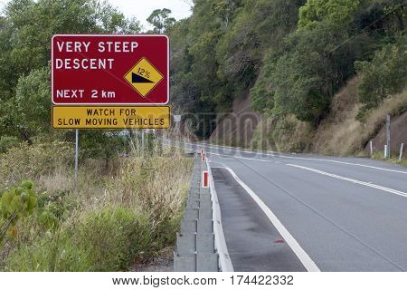 Very Steep Descent signage beside an Australian country road.