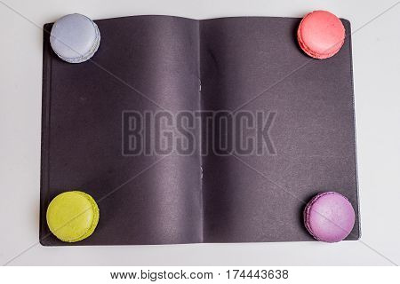 French Macaronsons On Black Paper