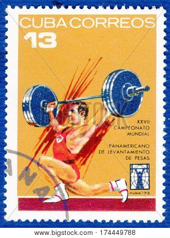 CUBA - CIRCA 1973: Postage stamp printed in Cuba  with a picture of a weightlifting, from the series 